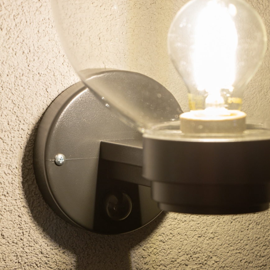 BRILAGI - Außen-Wandleuchte mit Bewegungsmelder HARBOR 1xE27/40W/230V IP33 schwarz/klar