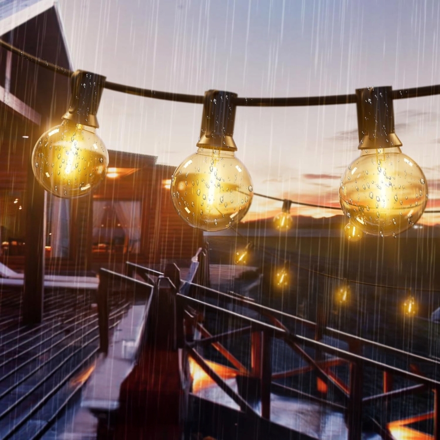 Dimmbare LED-Außen-Dekorations-Lichterkette 25xE12/1W/24/230V 17,5 m IP65 schwarz + Fernbedienung